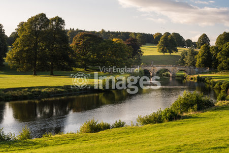 The River Derwent which runs through the Chatworth estate, straightened by Capability Brown in his work paying out the parkland in the 18th century. Stone bridge.